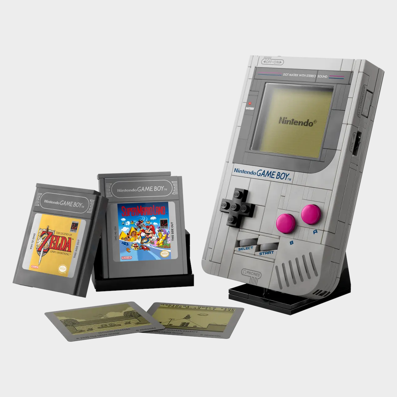 Lego Game Boy and cartridges laid out on a plain background