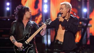 Guitarist Steve Stevens (L) and singer Billy Idol perform at the 2016 iHeartRadio Music Festival at T-Mobile Arena on September 23, 2016 in Las Vegas, Nevada.