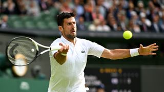 Novak Djokovic of Serbia plays a forehand against Pedro Cachin of Argentina in the Men's Singles first round match on day one of The Championships Wimbledon 2023 at All England Lawn Tennis and Croquet Club