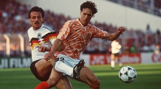 Jurgen Kohler of West Germany challenges Marco van Basten of the Netherlands during the 1988 UEFA European Championship in West Germany