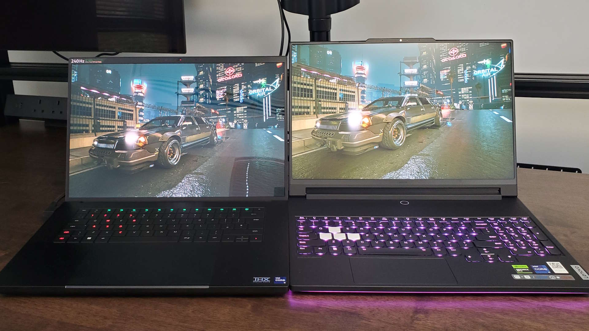 Razer Blade 16 (2024) and Lenovo Legion 9 gaming laptops side-by-side playing HDR content