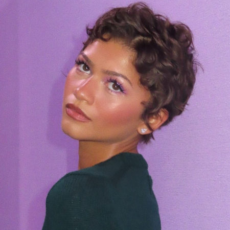 Zendaya with dark hair and highlights