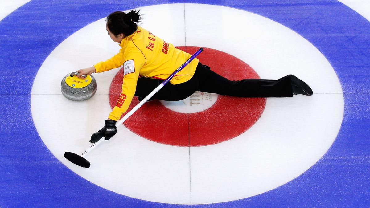 Qingshuang Yue of China releases the stone in curling world championship match.