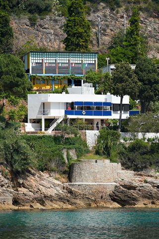 A house built on rocks that sits next to the French Riviera