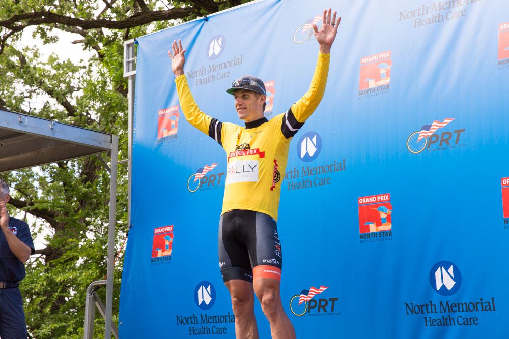 Tom Zirbel on the stage 1 podium at North Star Grand Prix