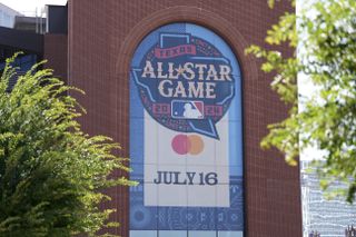 A general view of signage promoting the 2024 MLB All Star Game is shown outside the ballpark before the game between the Texas Rangers and the San Diego Padres at Globe Life Field on July 02, 2024 in Arlington, Texas.