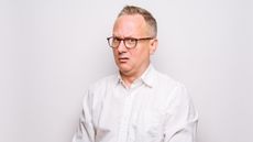 An older man looks perplexed.