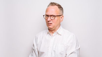 An older man looks perplexed.