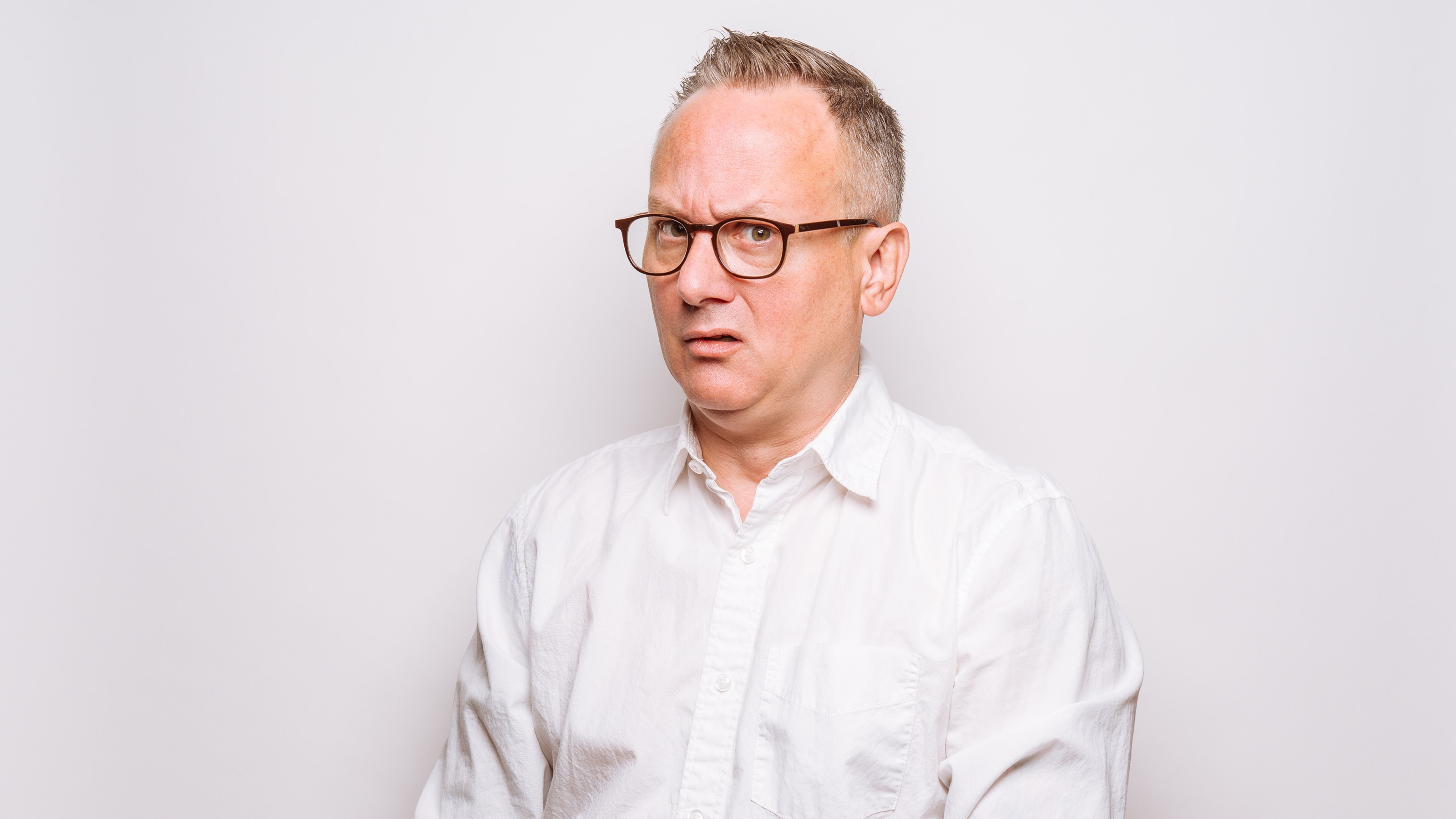 An older man looks perplexed.