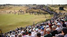 The view from a grandstand overlooking a green at The Open