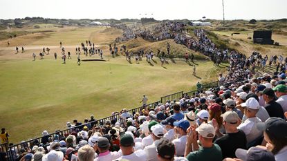 The view from a grandstand overlooking a green at The Open