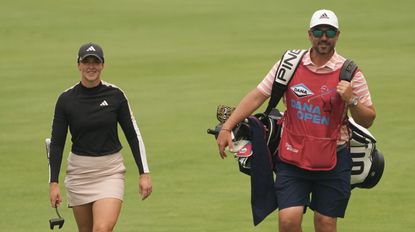Linn Grant and her caddie Michael Curry