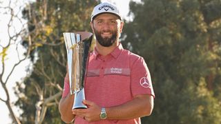 Jon Rahm with the trophy after winning the 2023 Genesis Invitational