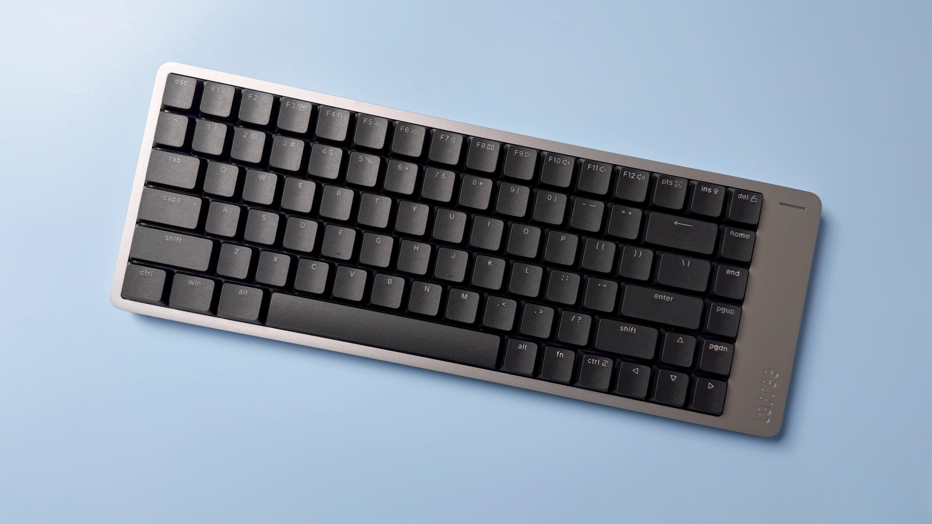 Lofree Flow 2 keyboard on a light blue background