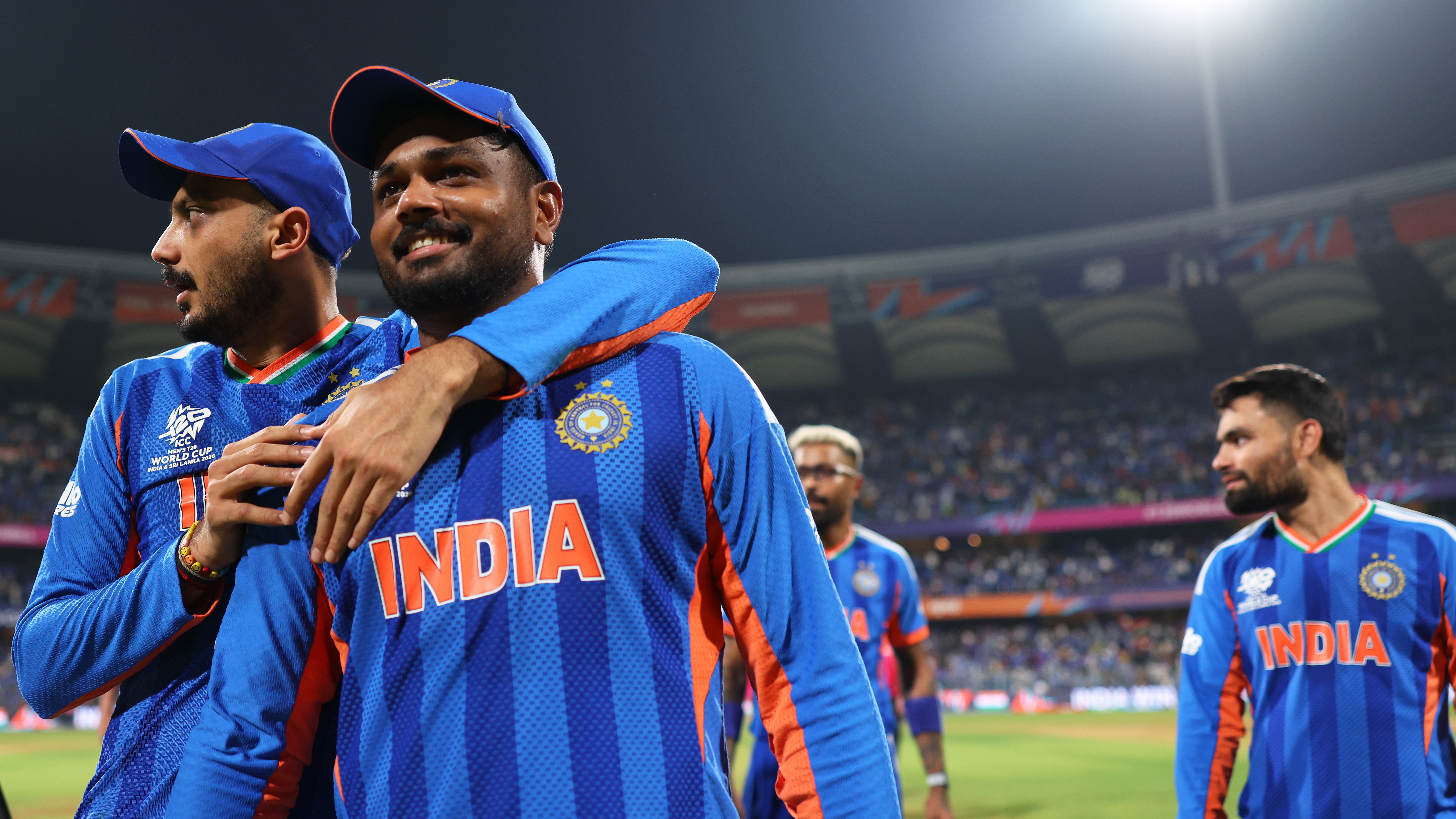 Axar Patel and Sanju Samson of India celebrate following the ICC Men's T20 World Cup India &amp; Sri Lanka 2026 Semi-Final match between India and England at Wankhede Stadium on March 05, 2026 in Mumbai, India.  