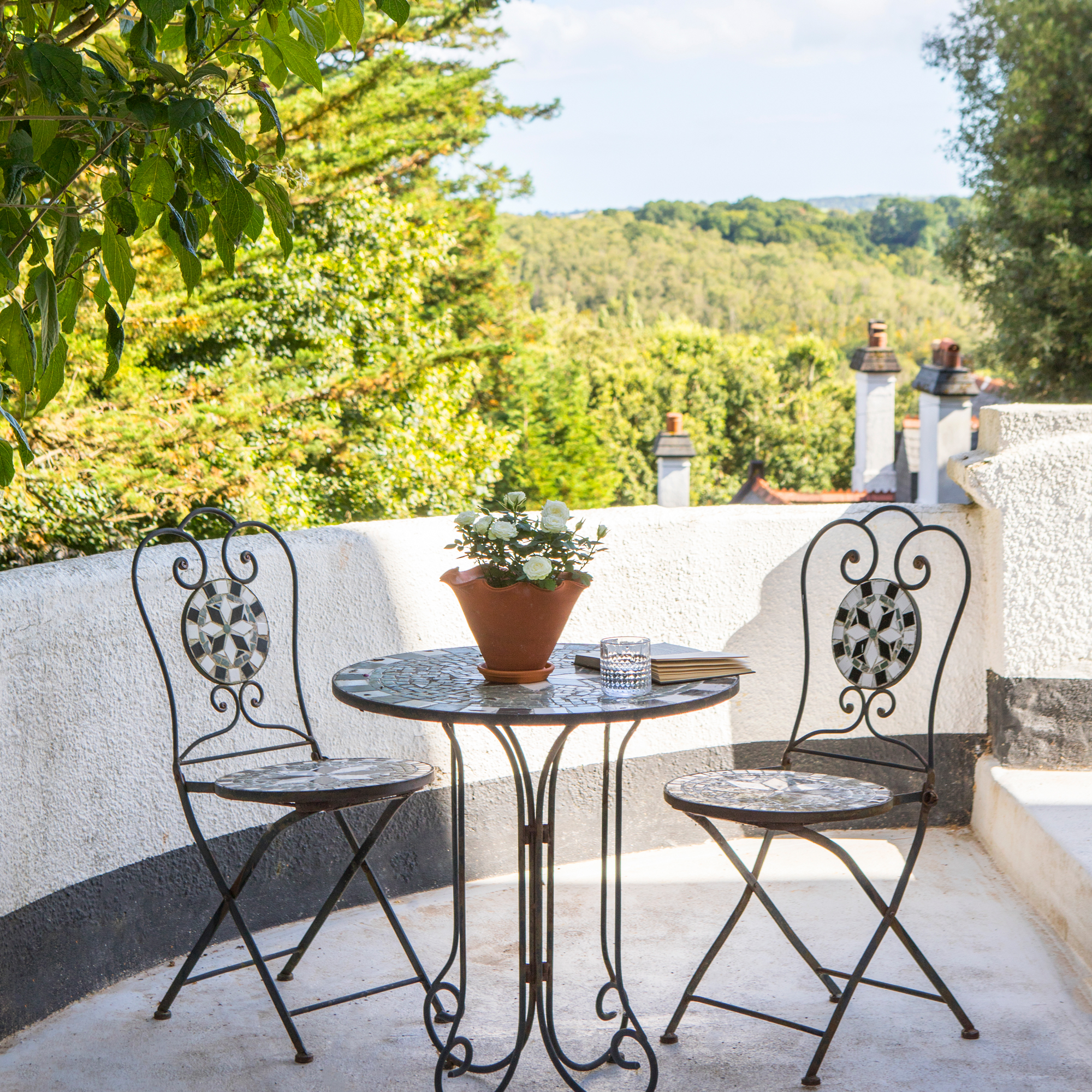 balcony near the entrance of the home, overlooking the nearby countryside