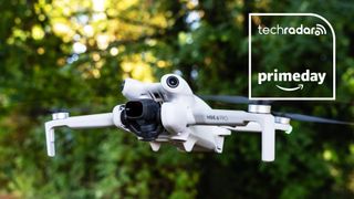 DJI Mini 4 Pro drone in flight, trees in the background, Amazon Prime Day text overlay