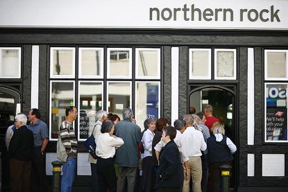 Customers queue to enter a Northern Rock bank branch in Bromley