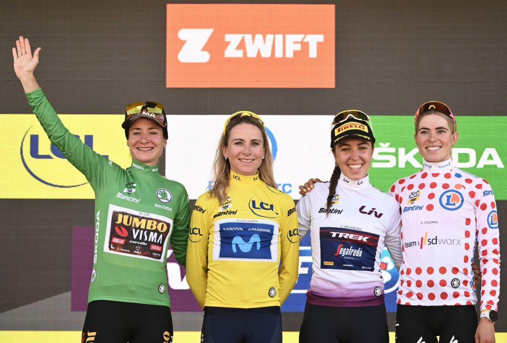 Marianne Vos wearing the sprinters green jersey, Annemiek Van Vleuten wearing the overall leader&#039;s yellow jersey, Shirin Van Anrooij wearing the best young riders white jersey, and Demi Vollering wearing the climbers dotted jersey celebrate on the podium after the 8th and final stage of the new edition of the Women&#039;s Tour de France 