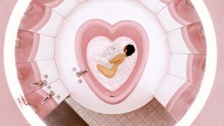 woman in a pink bathtub
