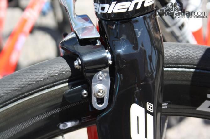 The brakes are attached to the frame at two points and are a halfway house between standard caliper and brakes integrated into the fork.