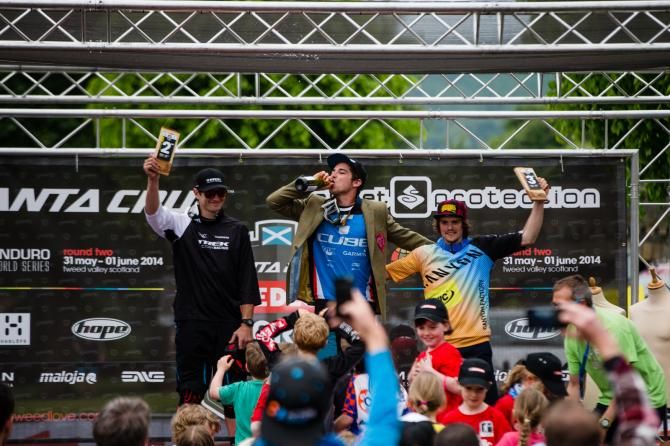Men's Tweedlove Enduro World Series Podium: Justin Leov, Nico Lau on the top step sporting his new tweed jacket and Scotsman Joe Barnes
