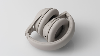 Final Audio UX2000 headphones folded up, on white background