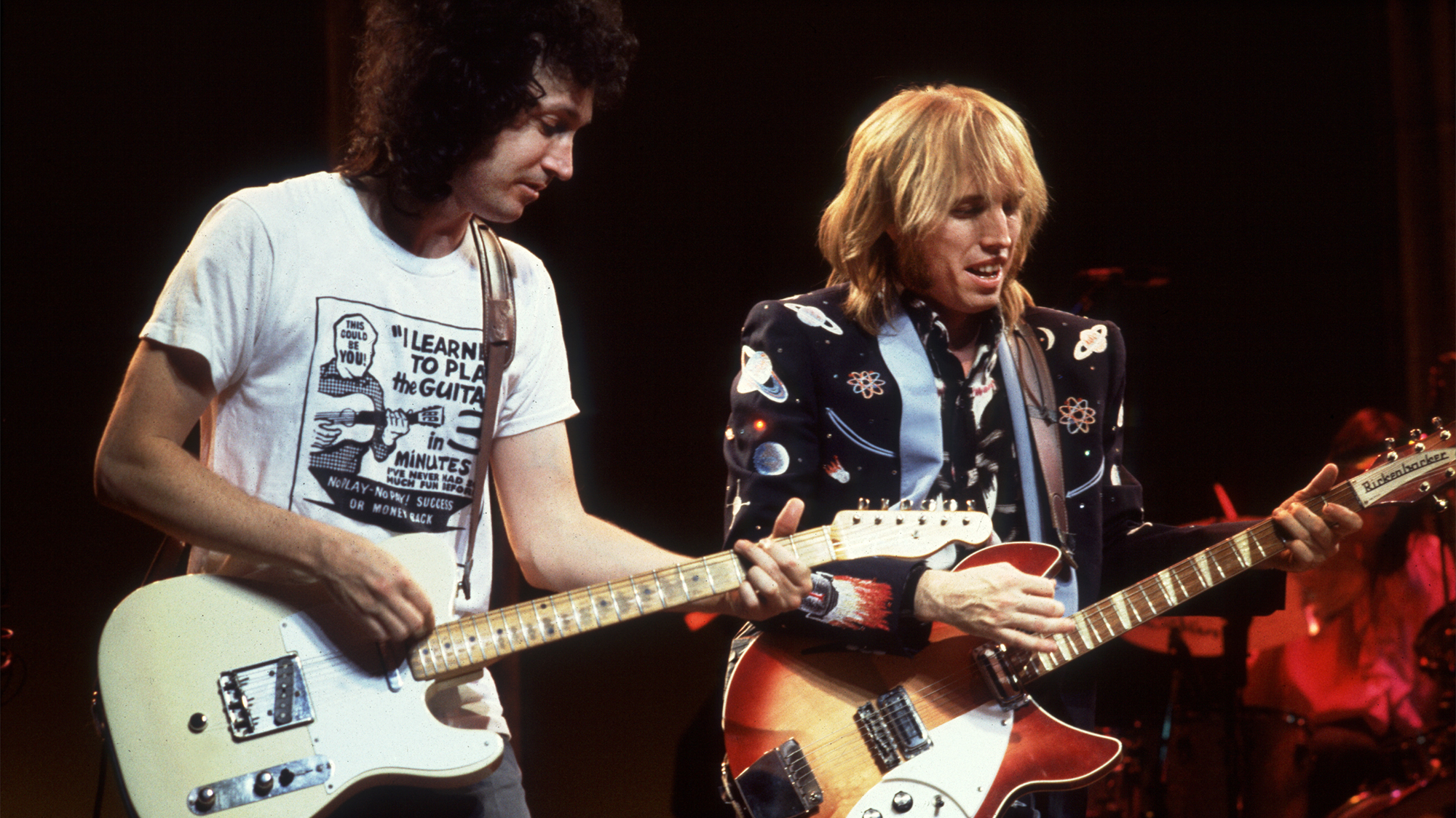 Tom Petty (right) and Mike Campbell perform at the Poplar Creek Music Theater in Hoffman Estates, Illinois, June 22, 1985. 