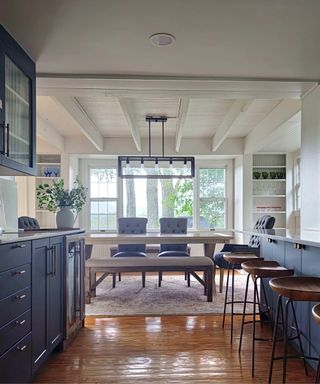 Modern farmhouse kitchen with blue cabinets and fluted glass