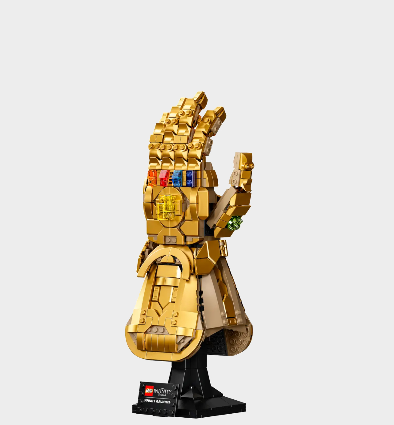 Lego Infinity Gauntlet on a stand against a plain background