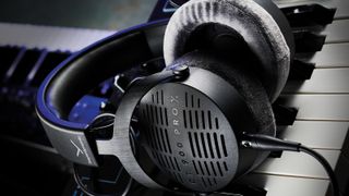 Beyerdynamic DT 900 PRO X open-back headphones on a keyboard