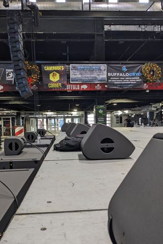 Coaxial X12 monitor wedges and X8 fills line the front of the stage