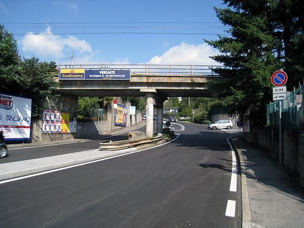 On Via Trentini for 100m, then right after passing the bridge (this road is descended in the other direction before -10km).