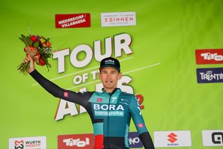 TOBLACH HOCHPUSTERTAL ITALY APRIL 20 Lennard Kmna of Germany and Team Bora Hansgrohe celebrates winning the stage on the podium ceremony after the 45th Tour of the Alps 2022 Stage 3 a 1546km stage from Lana to Villabassa TouroftheAlps on April 20 2022 in Toblach Hochpustertal Italy Photo by Tim de WaeleGetty Images