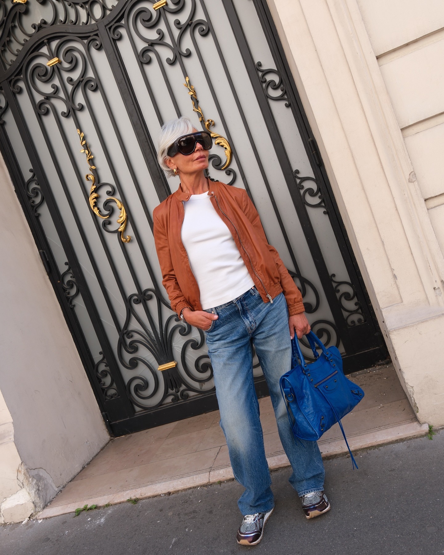 A woman posing in Paris with a 