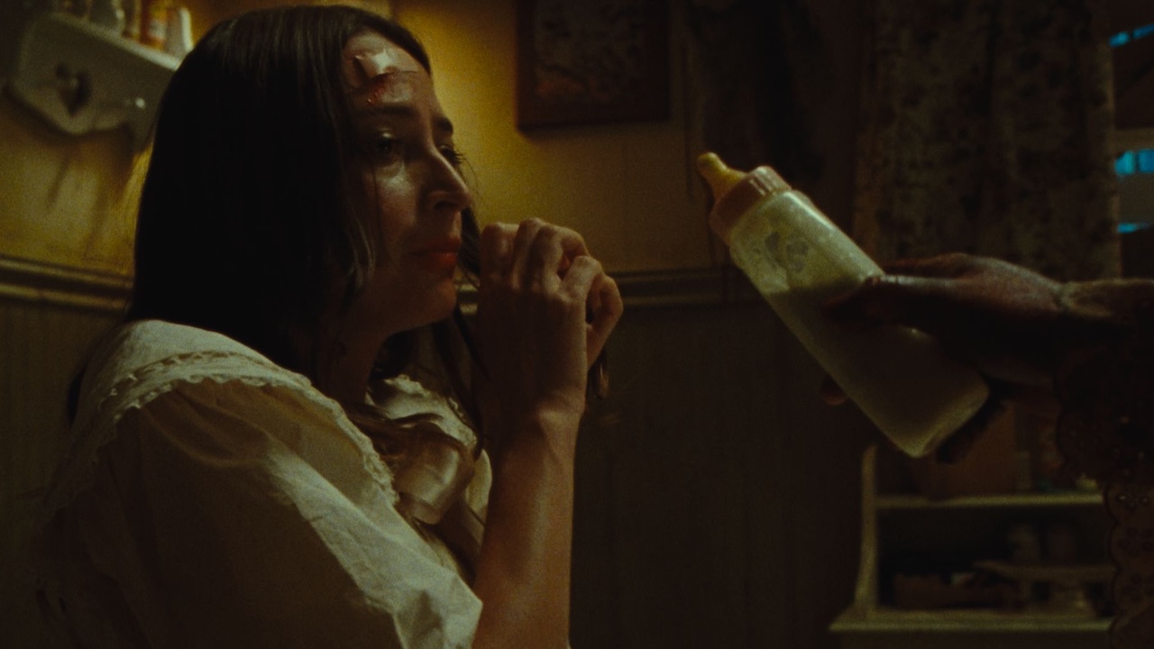 Fabienne Terese's Macy being reluctantly given a baby bottle in Dolly