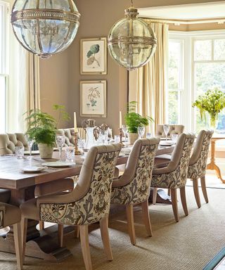 Traditional dining room with pendant light and wood table