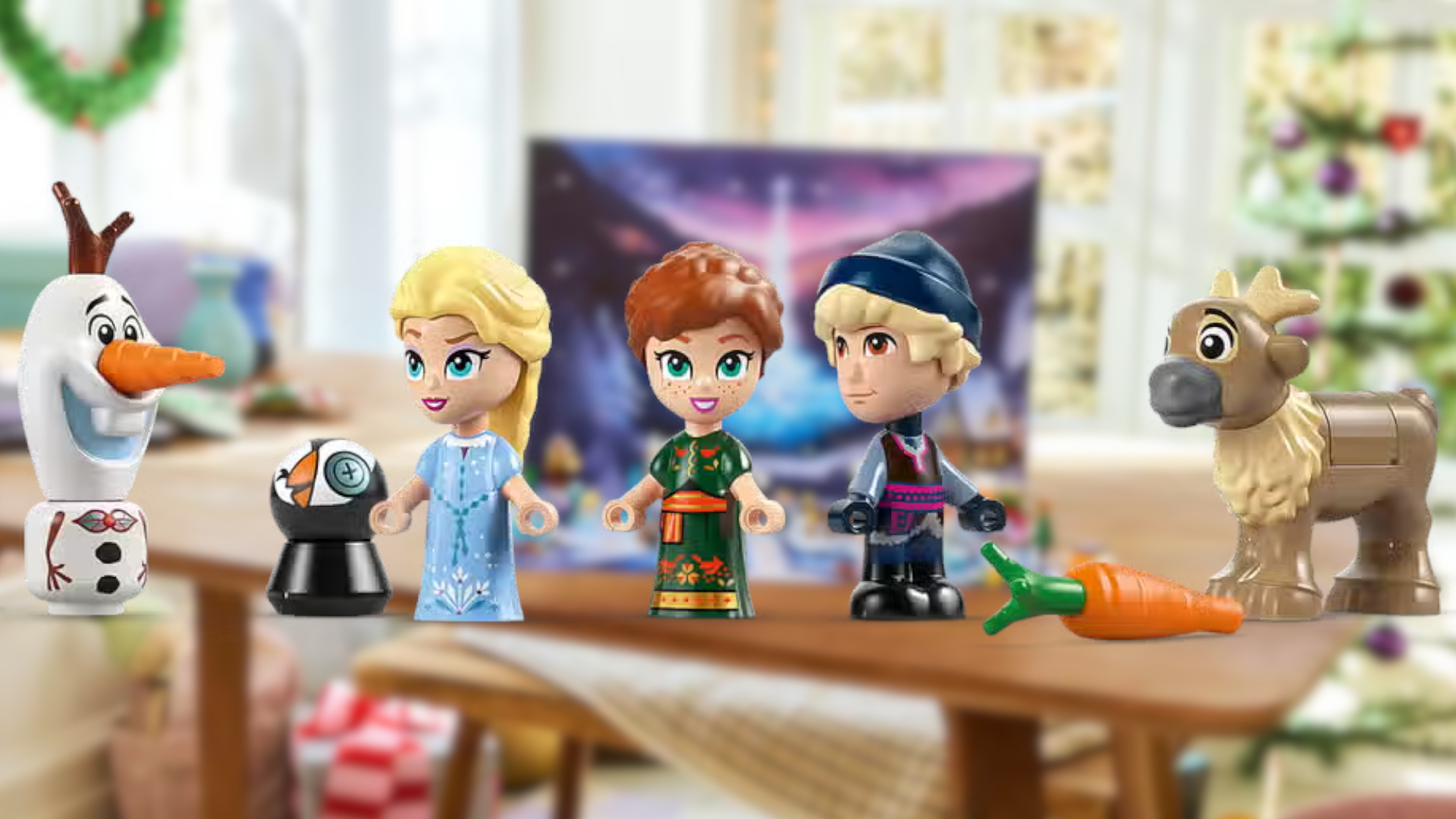 Lego Frozen minifigures in front of a blurred, Christmas-themed background