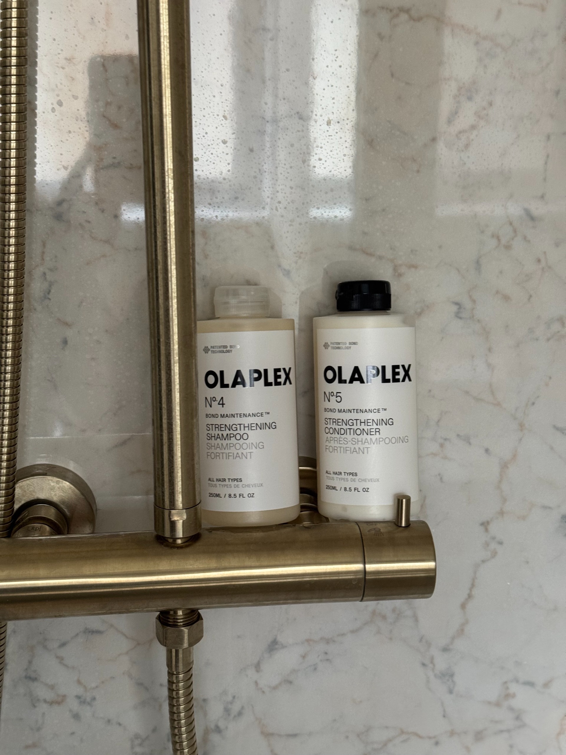 the olaplex shampoo and conditioner in a bathroom