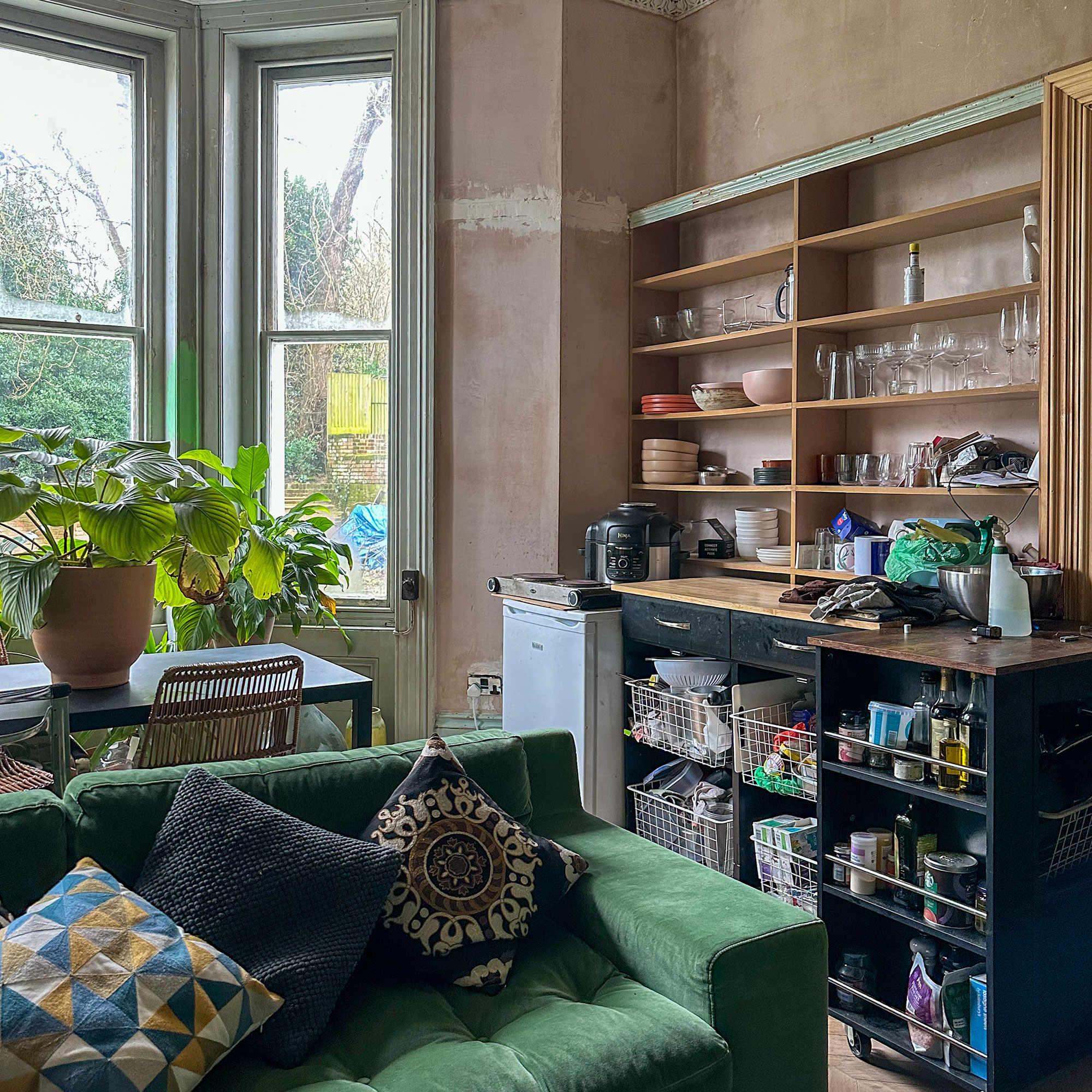 Makeshift open kitchen against wall