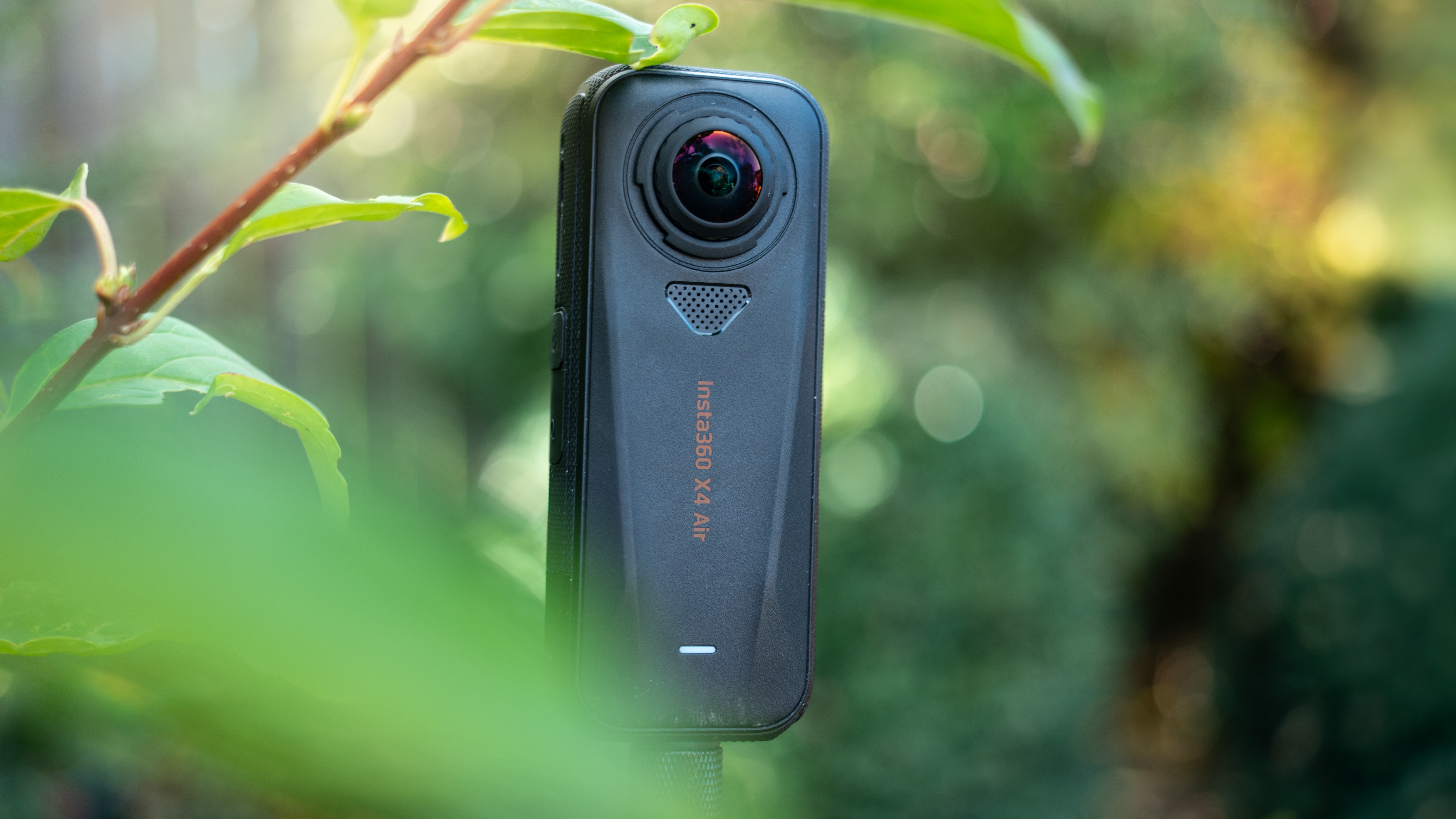 The Insta360 X4 Air outdoors in a garden setting