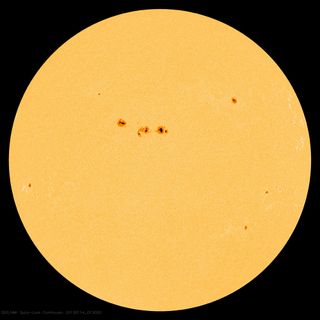 This image from NASA's Solar Dynamics Observatory was captured on Jan. 13, 2013, at 8:13 p.m. EST. At the center sits a large cluster of sunspots, dubbed Active Region 11654.