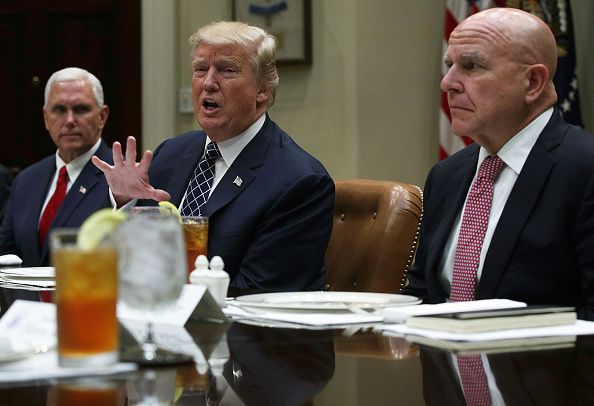 Trump speaks as Pence, McMaster look on.