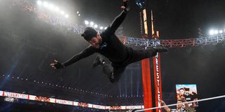Bad Bunny diving off the top rope at WrestleMania 37