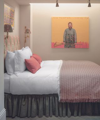 Bedroom with artwork over the bed