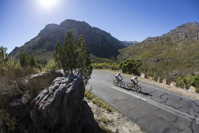 Christoph Sauser and Jaroslav Kulharvy of Burry Stander-Songo work to make up time