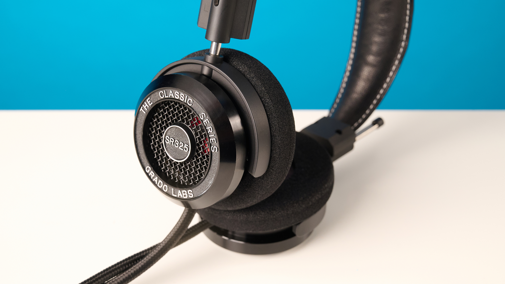 Grado SR325 photographed in front of a blue background