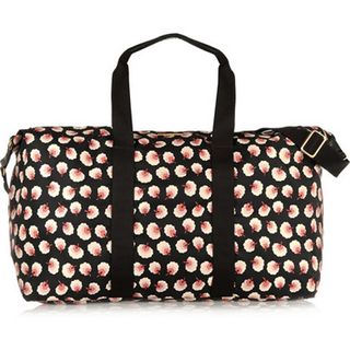 Stella McCartney's Noemi Floral-Print Canvas Weekend Bag in black with pink floral pattern