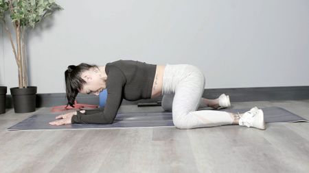 Sam Hopes performing a frog pose