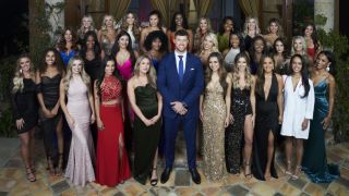 Clayton Echard stands with the Season 26 cast of The Bachelor.